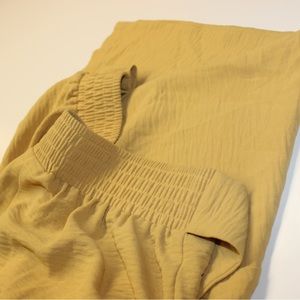 Golden colored flowy pants